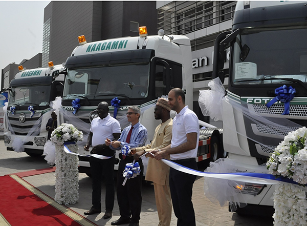 Top Executives of JMTC joined by guests to cut tape to unveil the trucks